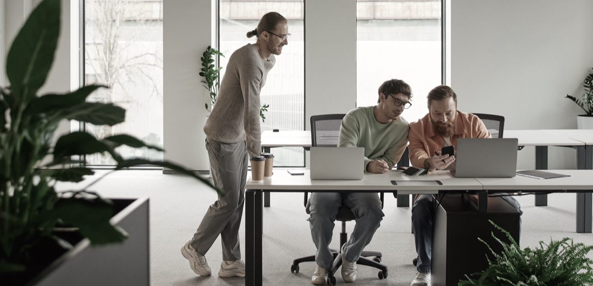 A team of developers collaborating in a bright open office